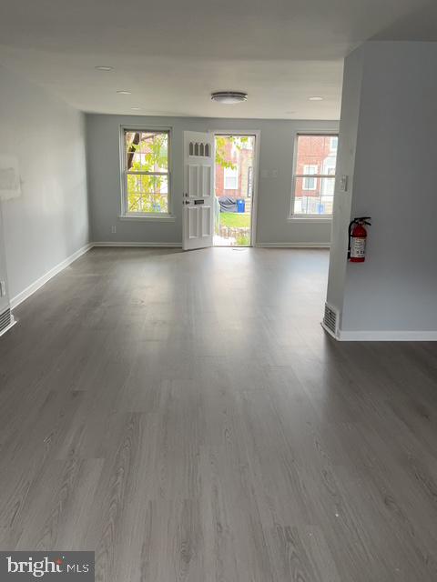 631 Anchor Street Philadelphia, PA 19120 - Photo 8 of 18 wooden floor in an empty room with a window