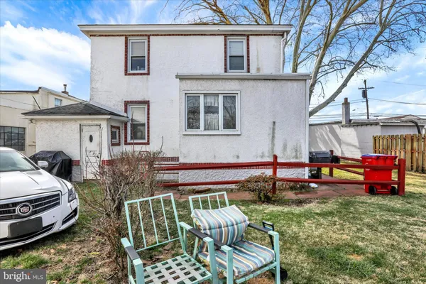 a view of a patio with a table and chairs