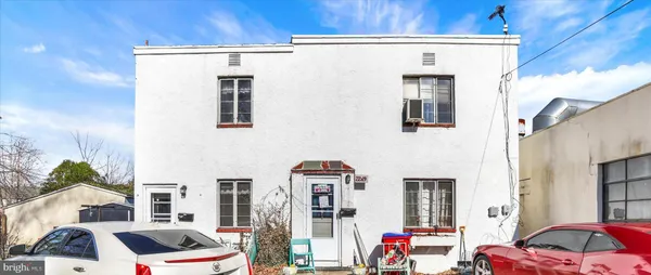 a front view of a house with parking