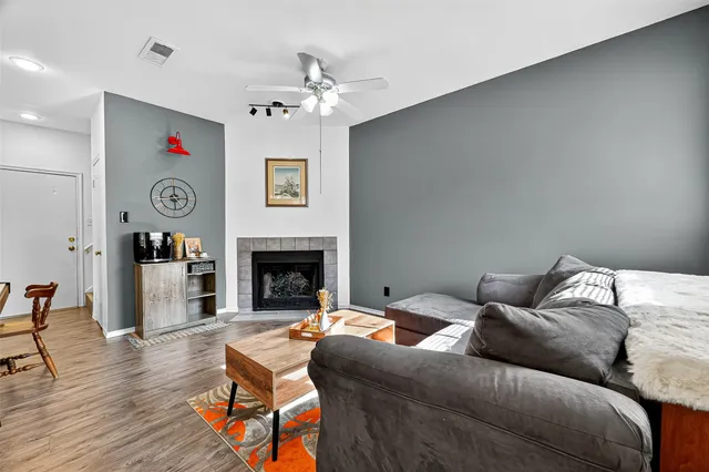 a living room with furniture and a fireplace
