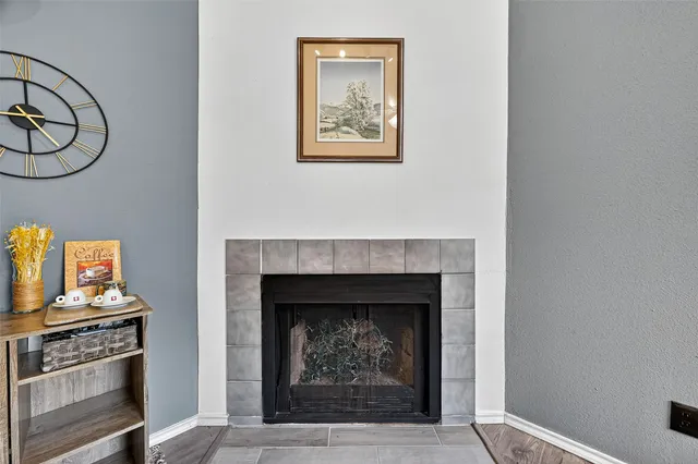a living room with a fireplace and a stove