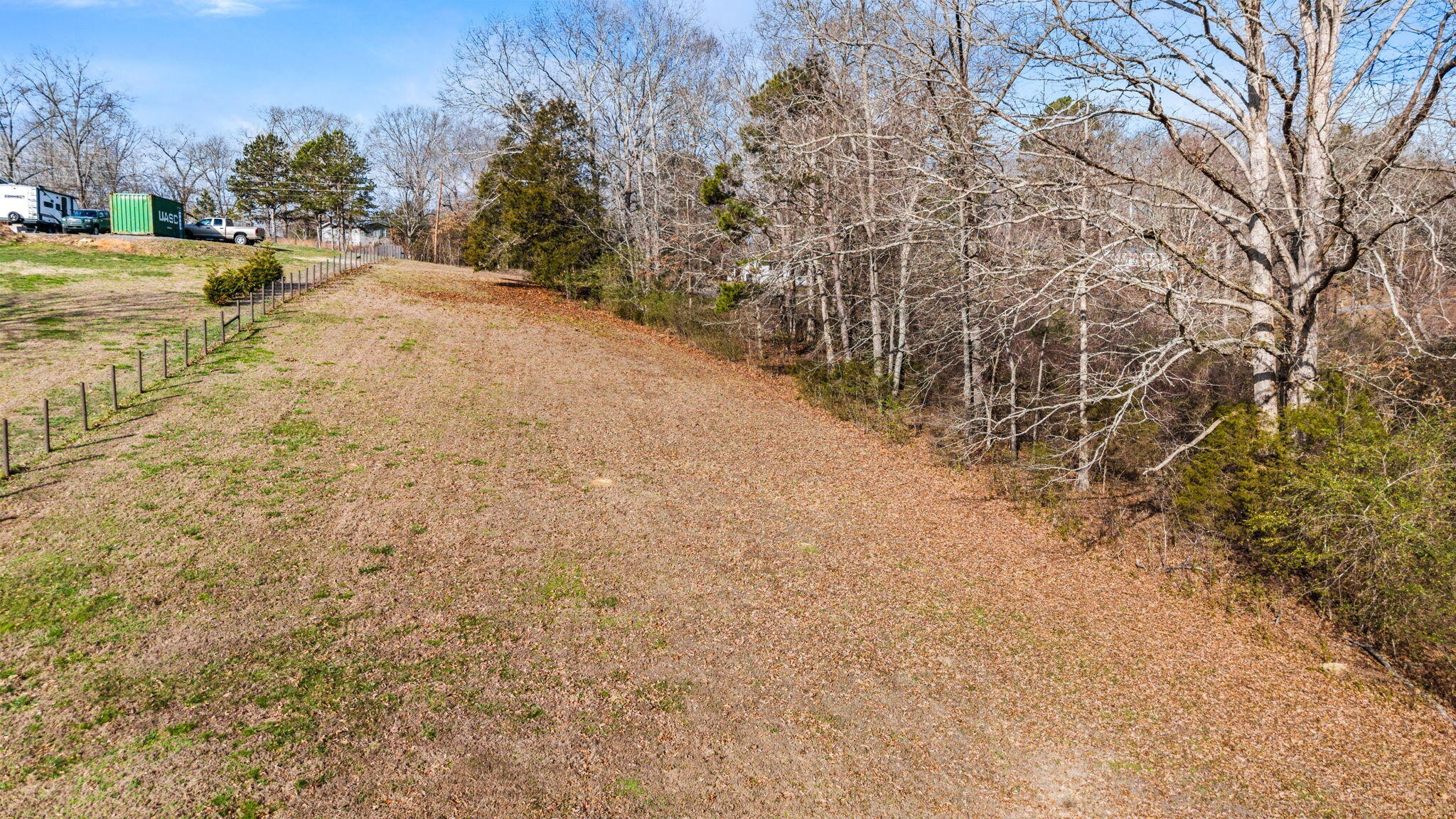 12108 Bettis Road Georgetown, TN 37336 - Photo 2 of 22 a view of a yard with trees