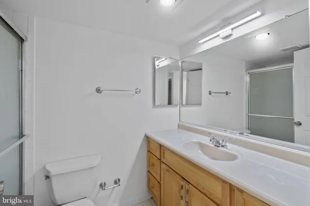 a view of an empty room and closet area