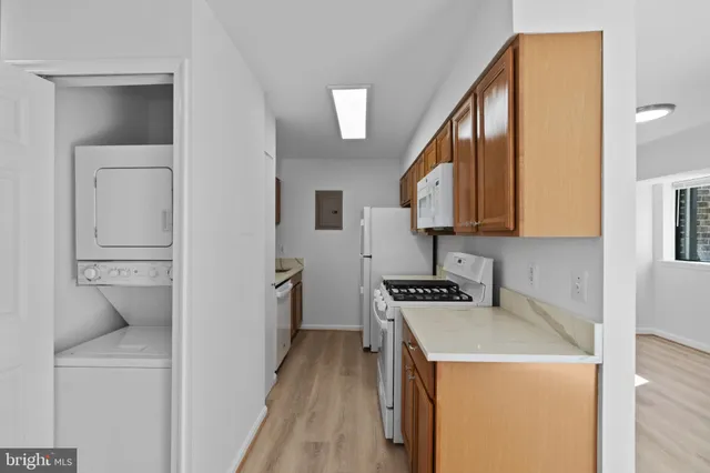 a kitchen with a stove and a refrigerator