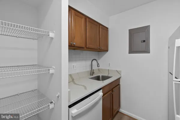 a kitchen with a sink and cabinets