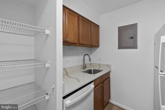a kitchen with a sink and cabinets