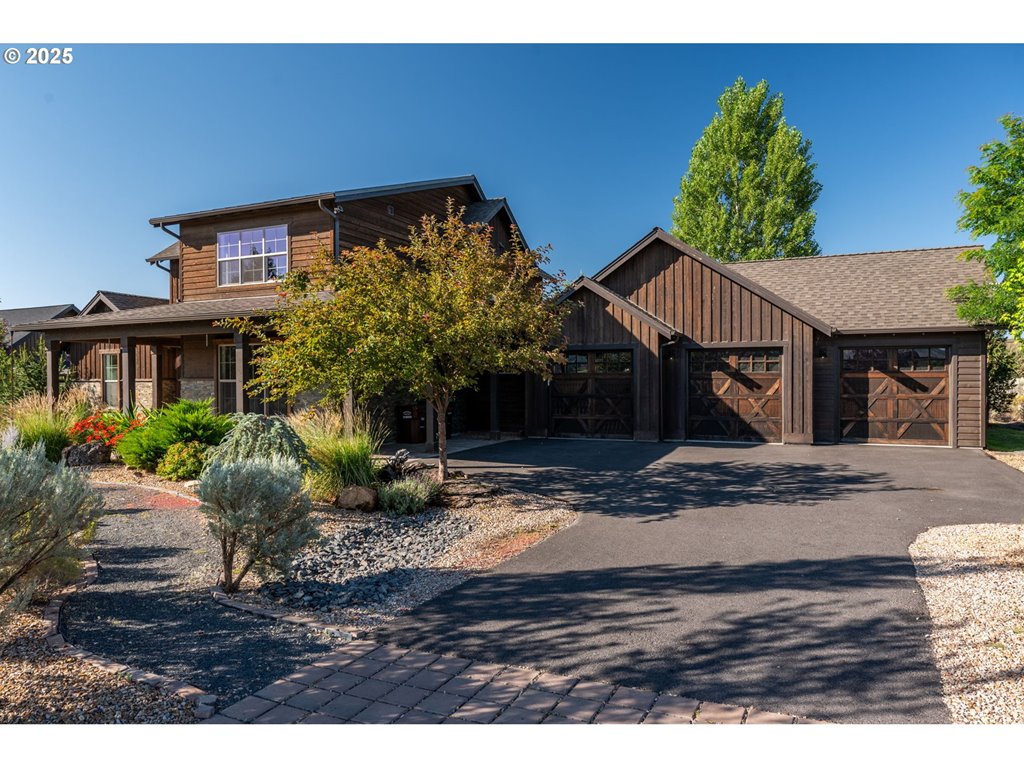 16486 Southwest Ranchview Road Powell Butte, OR 97753 - Photo 1 of 44 a view of a house with backyard and sitting area