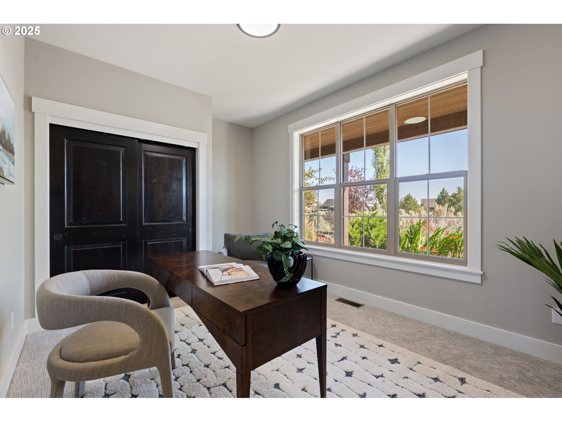 16486 Southwest Ranchview Road Powell Butte, OR 97753 - Photo 26 of 44 a living room with furniture and a window