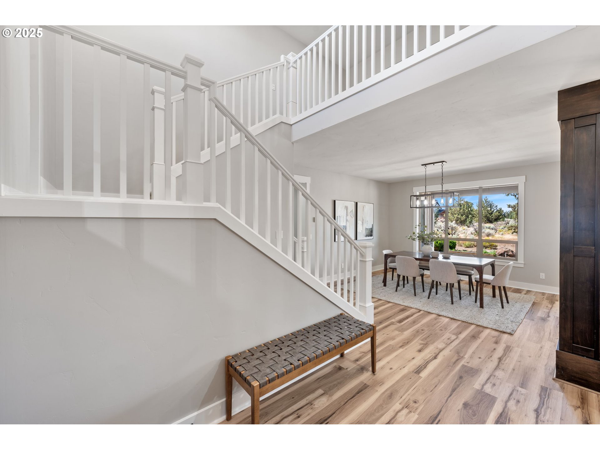 16486 Southwest Ranchview Road Powell Butte, OR 97753 - Photo 3 of 44 a living room with furniture and a wooden floor