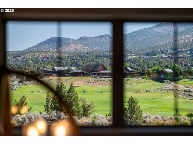 a bedroom with a large bed and a large window