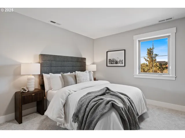 a bathroom with a granite countertop sink a toilet a mirror a vanity and shower