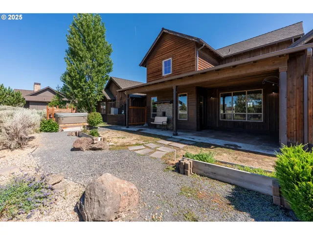 a view of a house with a yard and a mountain
