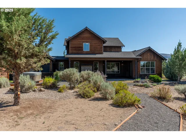a view of house with wooden fence