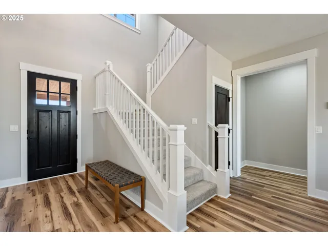 a view of entryway with wooden floor