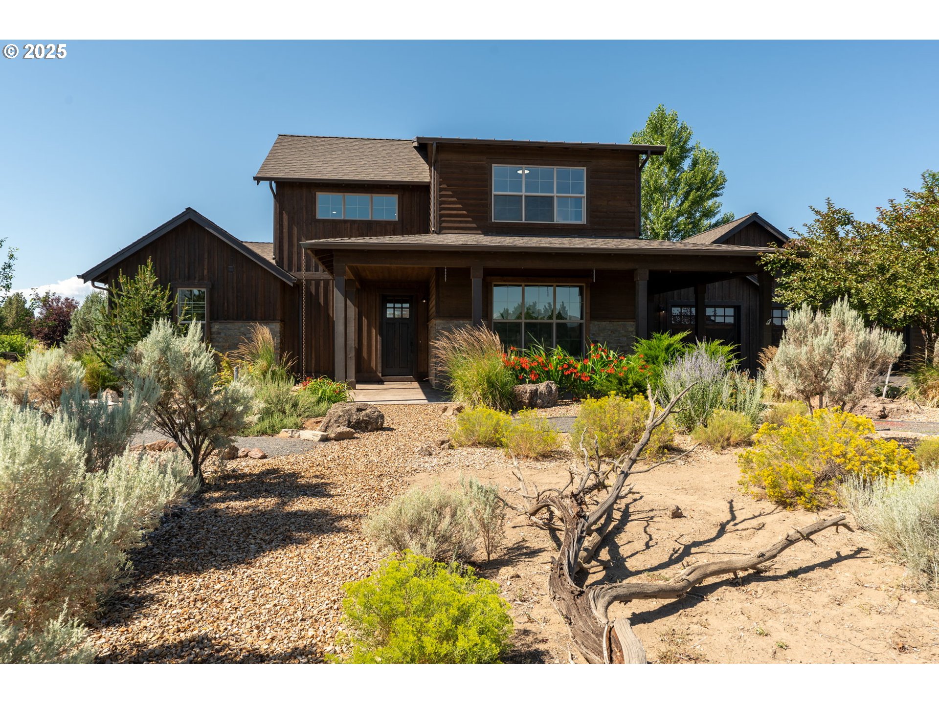 16486 Southwest Ranchview Road Powell Butte, OR 97753 - Photo 41 of 44 a view of house with wooden fence