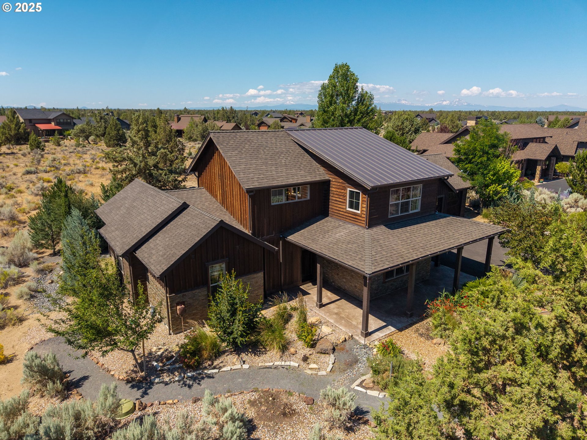 16486 Southwest Ranchview Road Powell Butte, OR 97753 - Photo 42 of 44 an aerial view of a house with a yard and sitting area