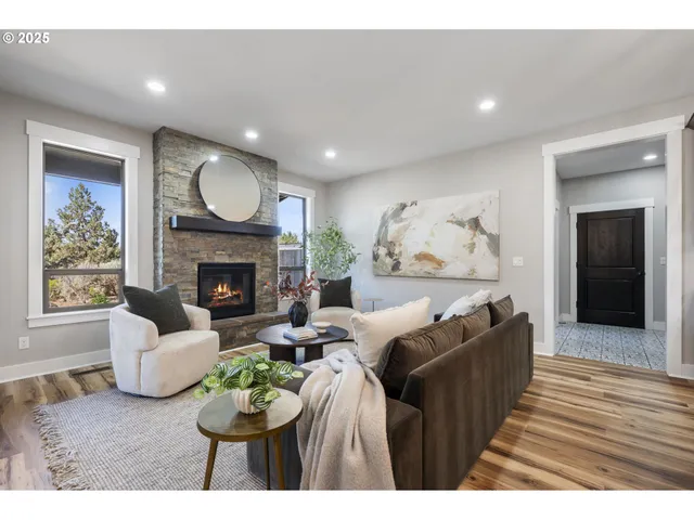 a living room with furniture fireplace and window