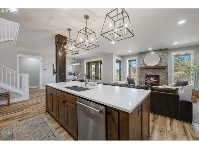 a kitchen with a sink and a wooden cabinets