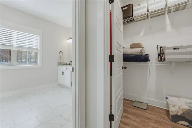 a view of storage and utility room with racks on the wall