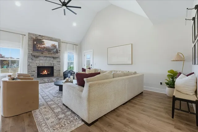 a living room with furniture and a fireplace