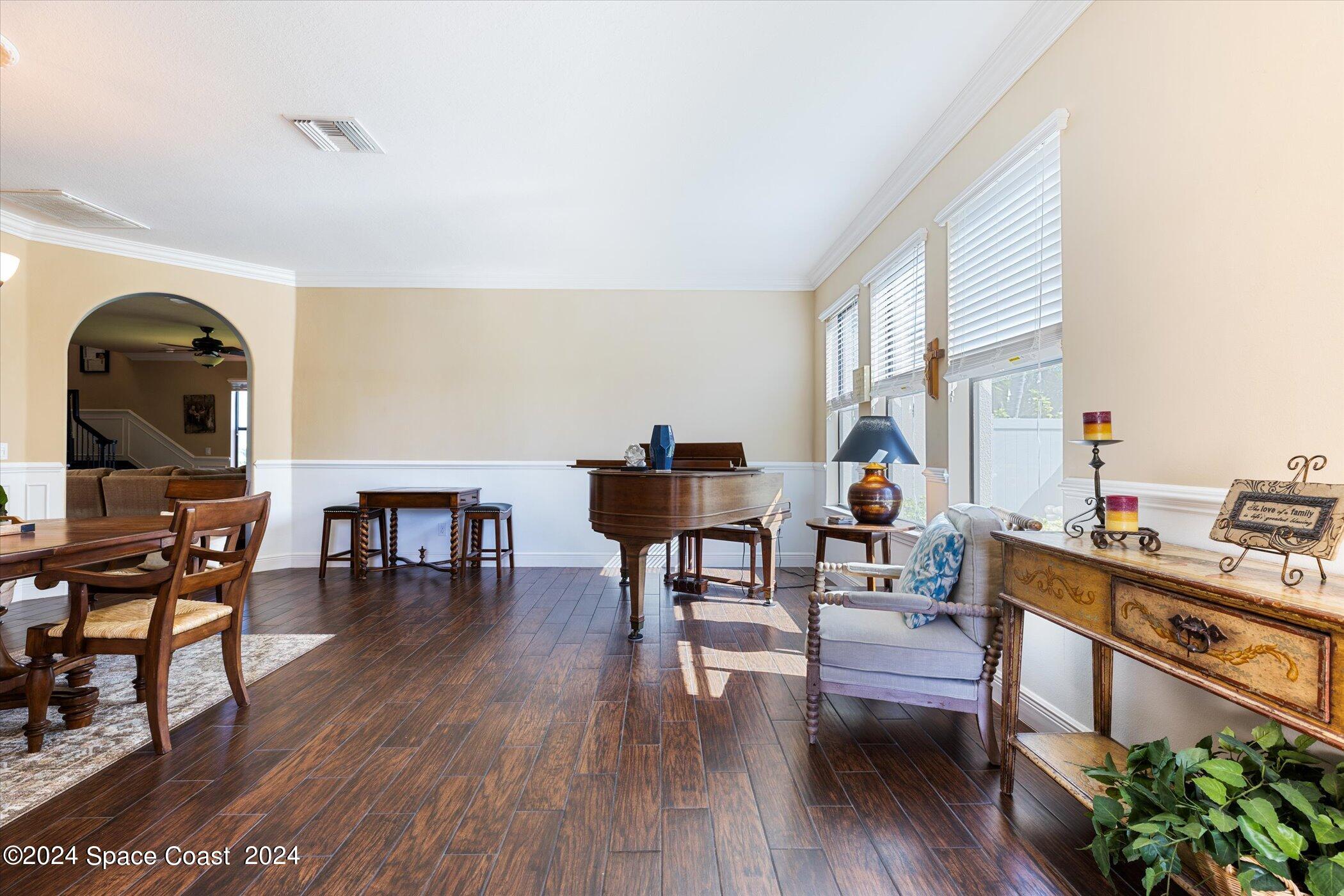 110 Poinsetta Street Indialantic, FL 32903 - Photo 11 of 67 a living room with furniture and wooden floor