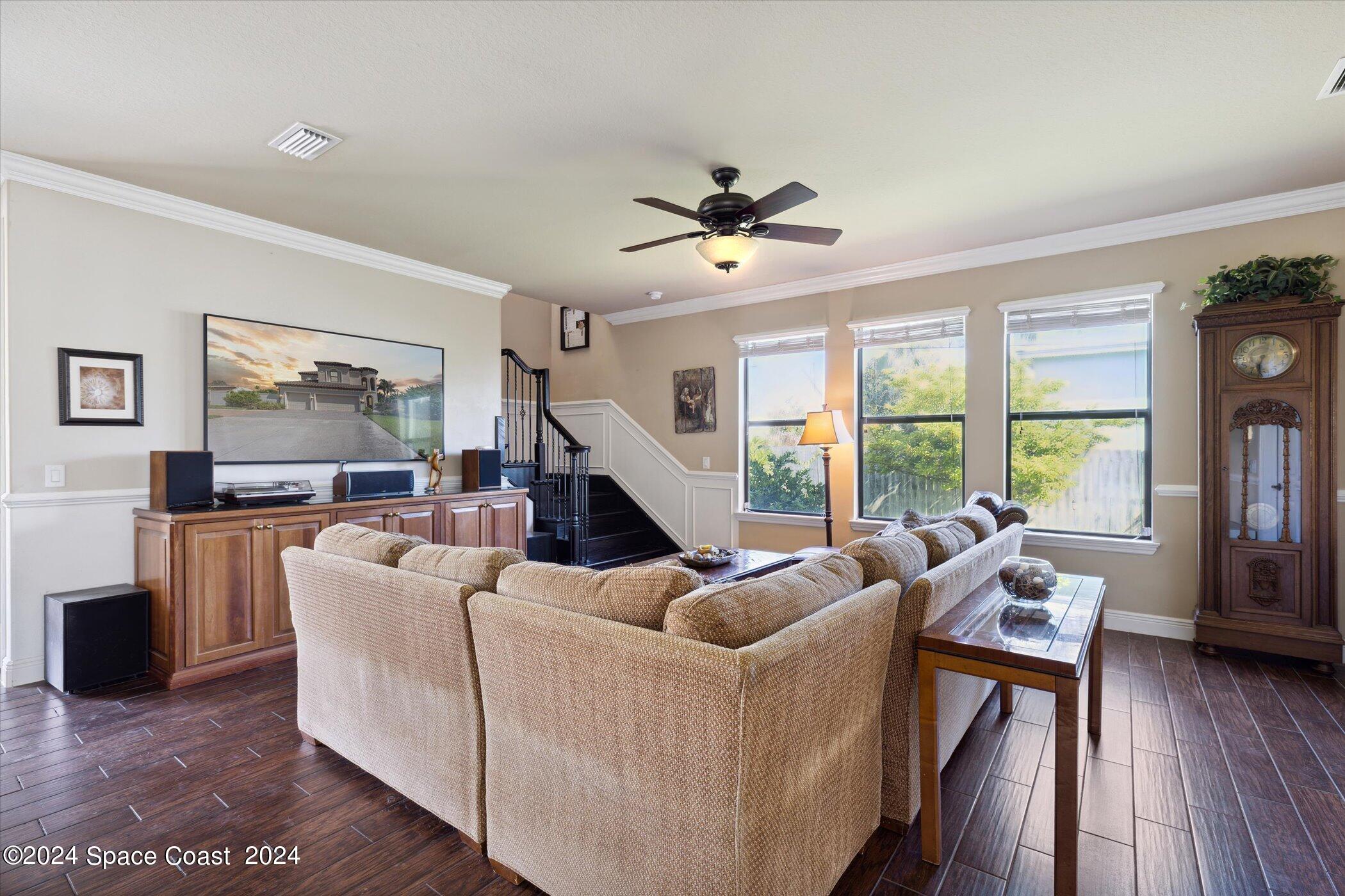 110 Poinsetta Street Indialantic, FL 32903 - Photo 21 of 67 a living room with furniture and a large window