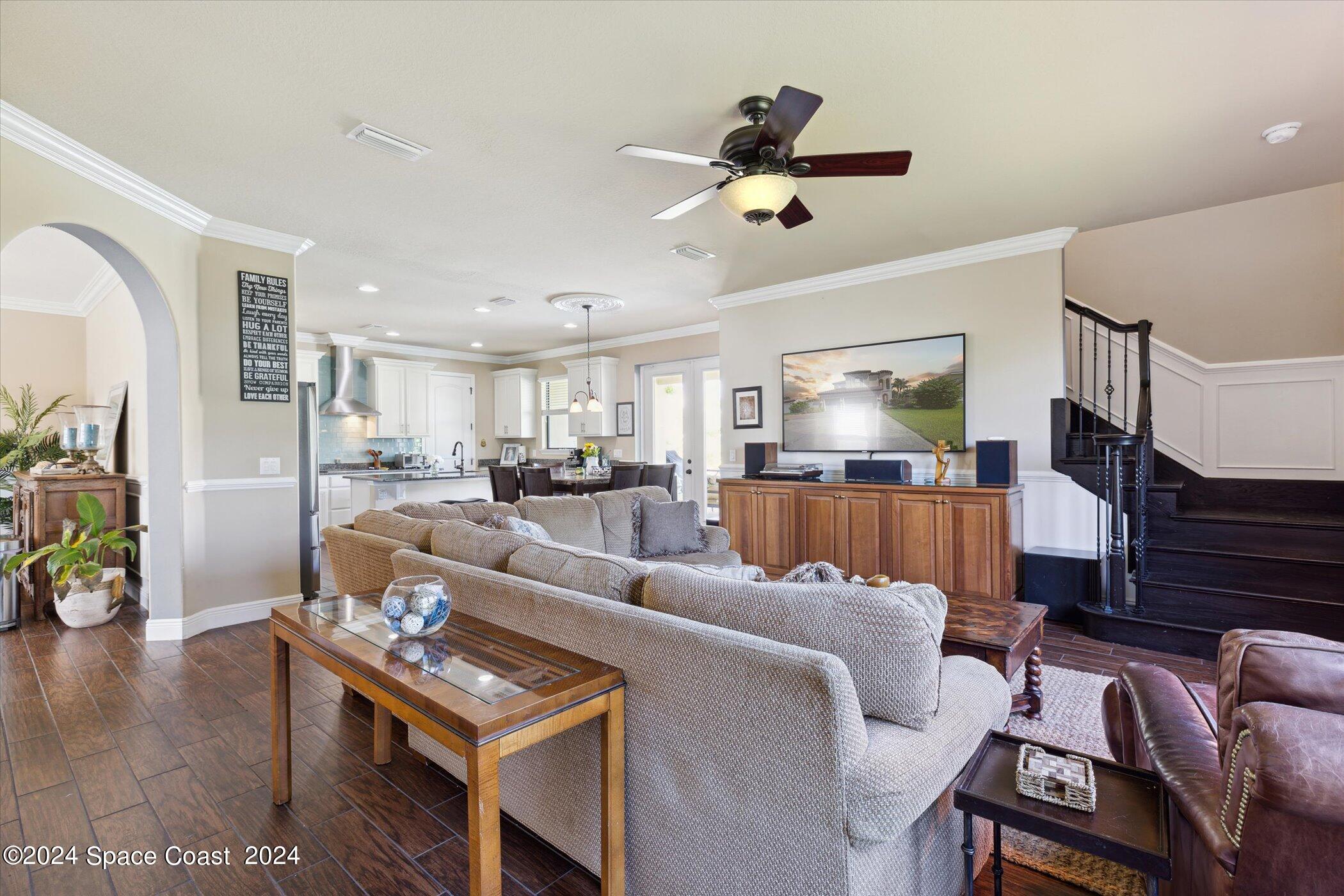 110 Poinsetta Street Indialantic, FL 32903 - Photo 22 of 67 a living room with furniture and a wooden floor