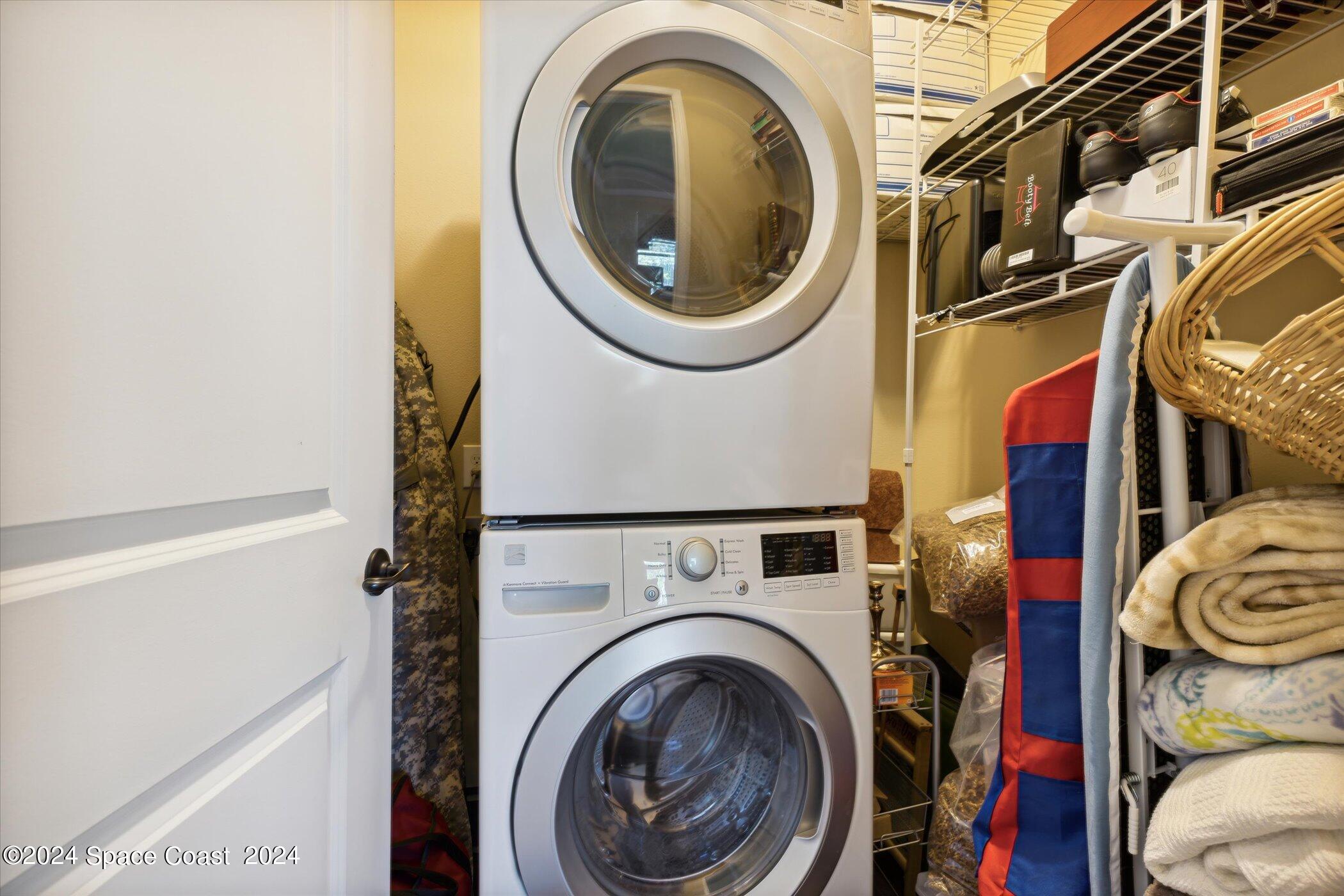 110 Poinsetta Street Indialantic, FL 32903 - Photo 29 of 67 a utility room with dryer and washer