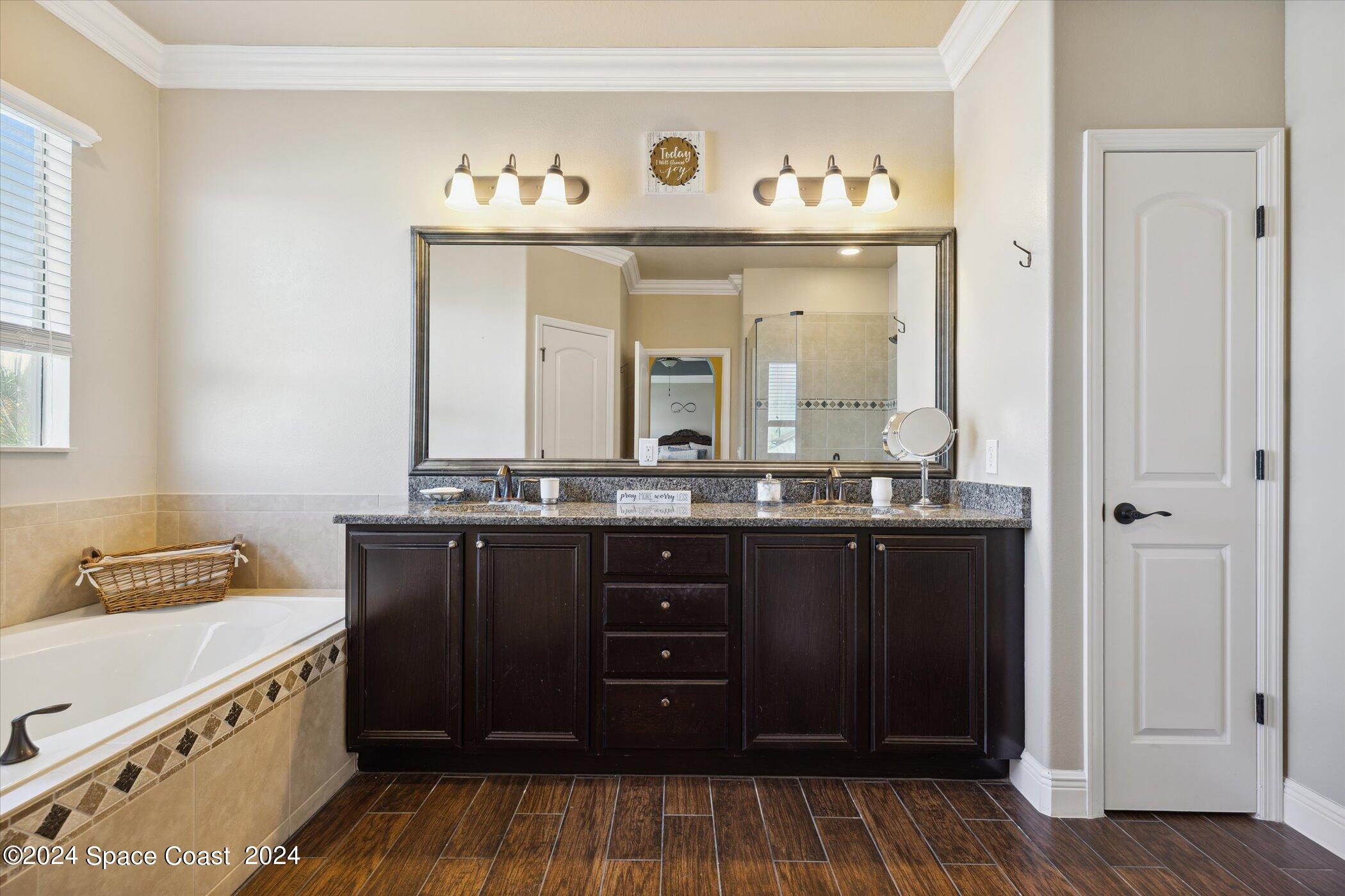 110 Poinsetta Street Indialantic, FL 32903 - Photo 32 of 67 a bathroom with a sink and a mirror