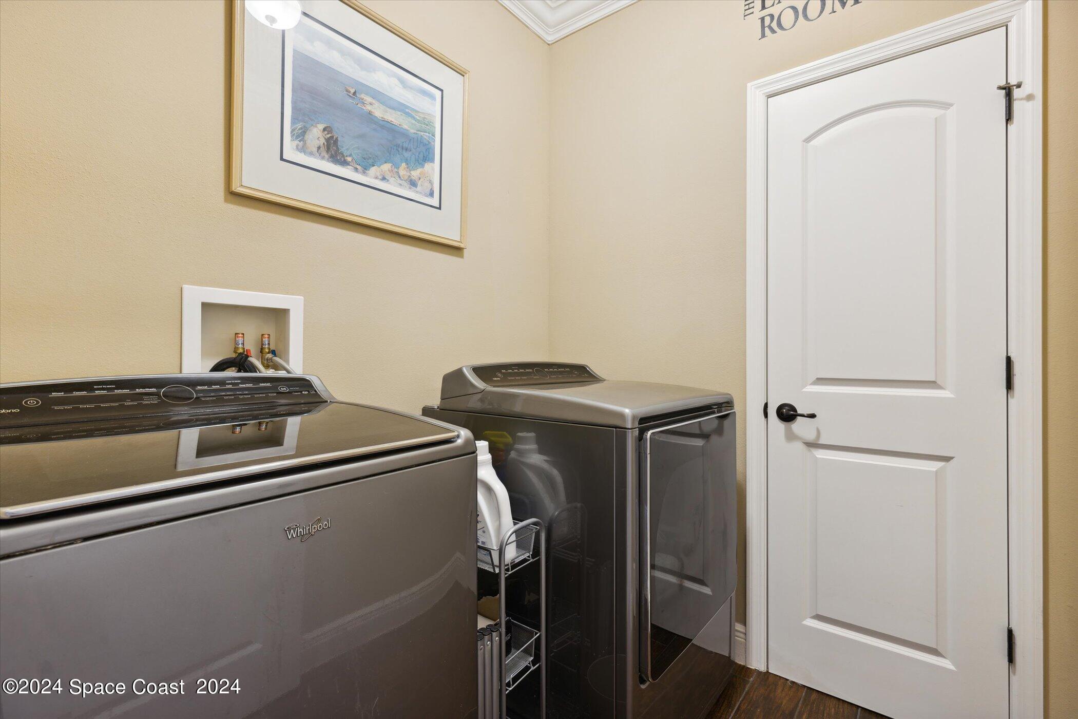 110 Poinsetta Street Indialantic, FL 32903 - Photo 38 of 67 a utility room with dryer and washer