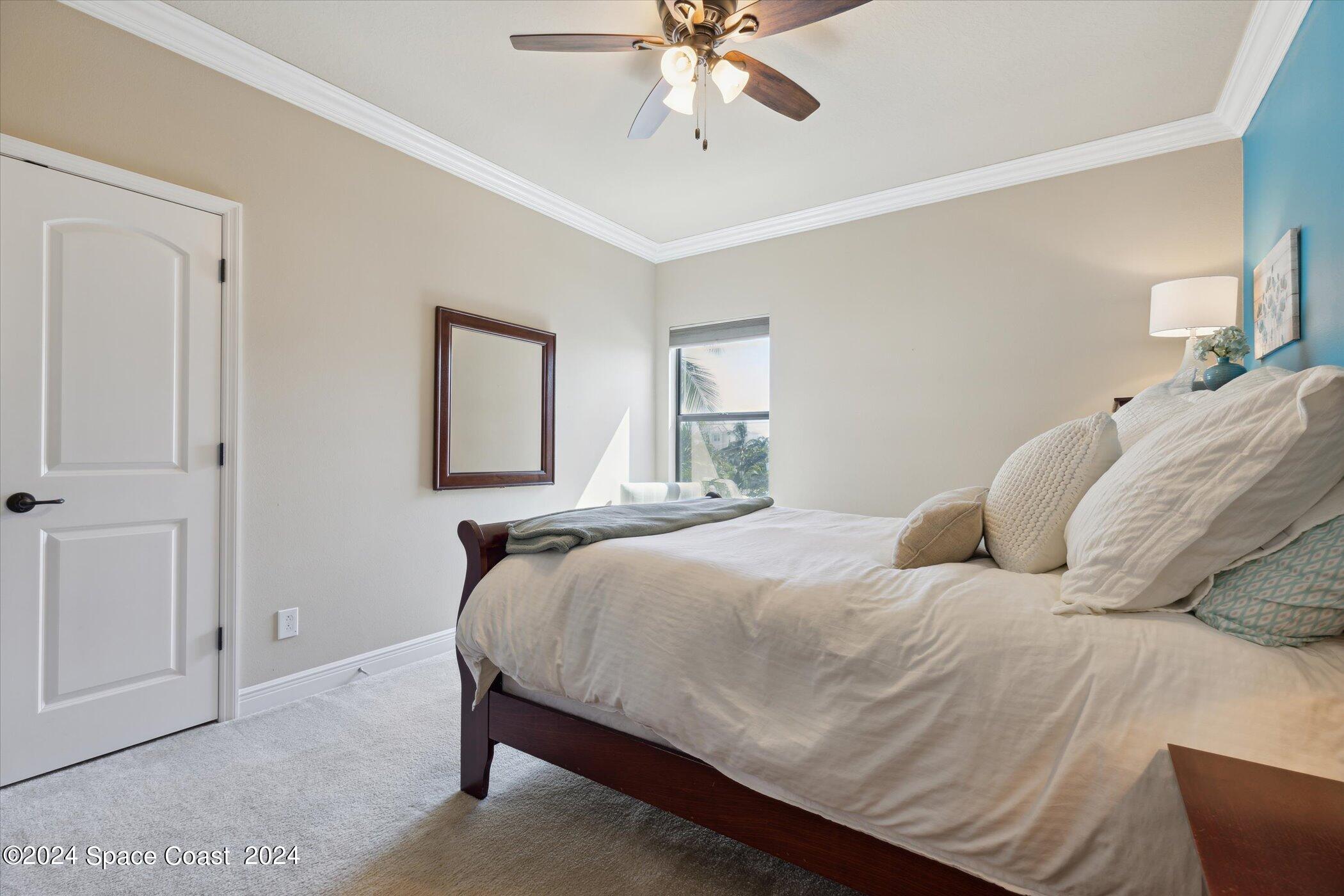 110 Poinsetta Street Indialantic, FL 32903 - Photo 39 of 67 a bedroom with a bed and window