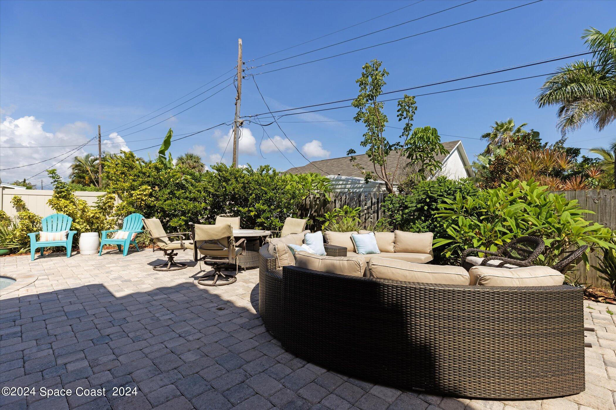 110 Poinsetta Street Indialantic, FL 32903 - Photo 49 of 67 a view of a patio with couches and potted plants