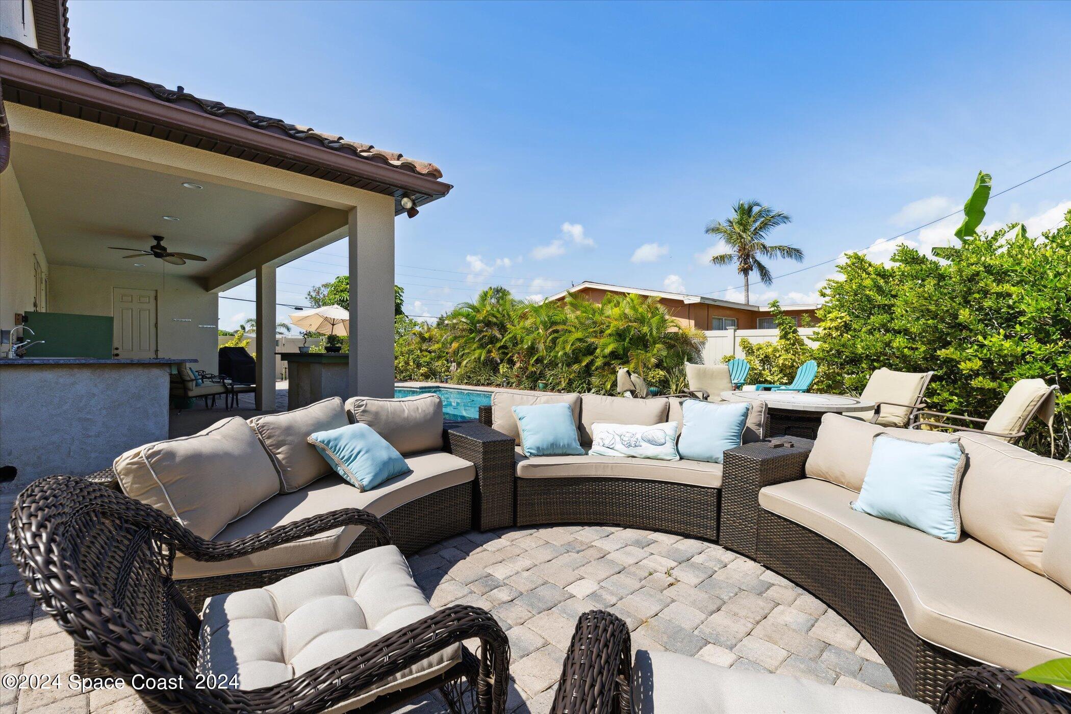 110 Poinsetta Street Indialantic, FL 32903 - Photo 50 of 67 a outdoor living space with furniture and a potted plant