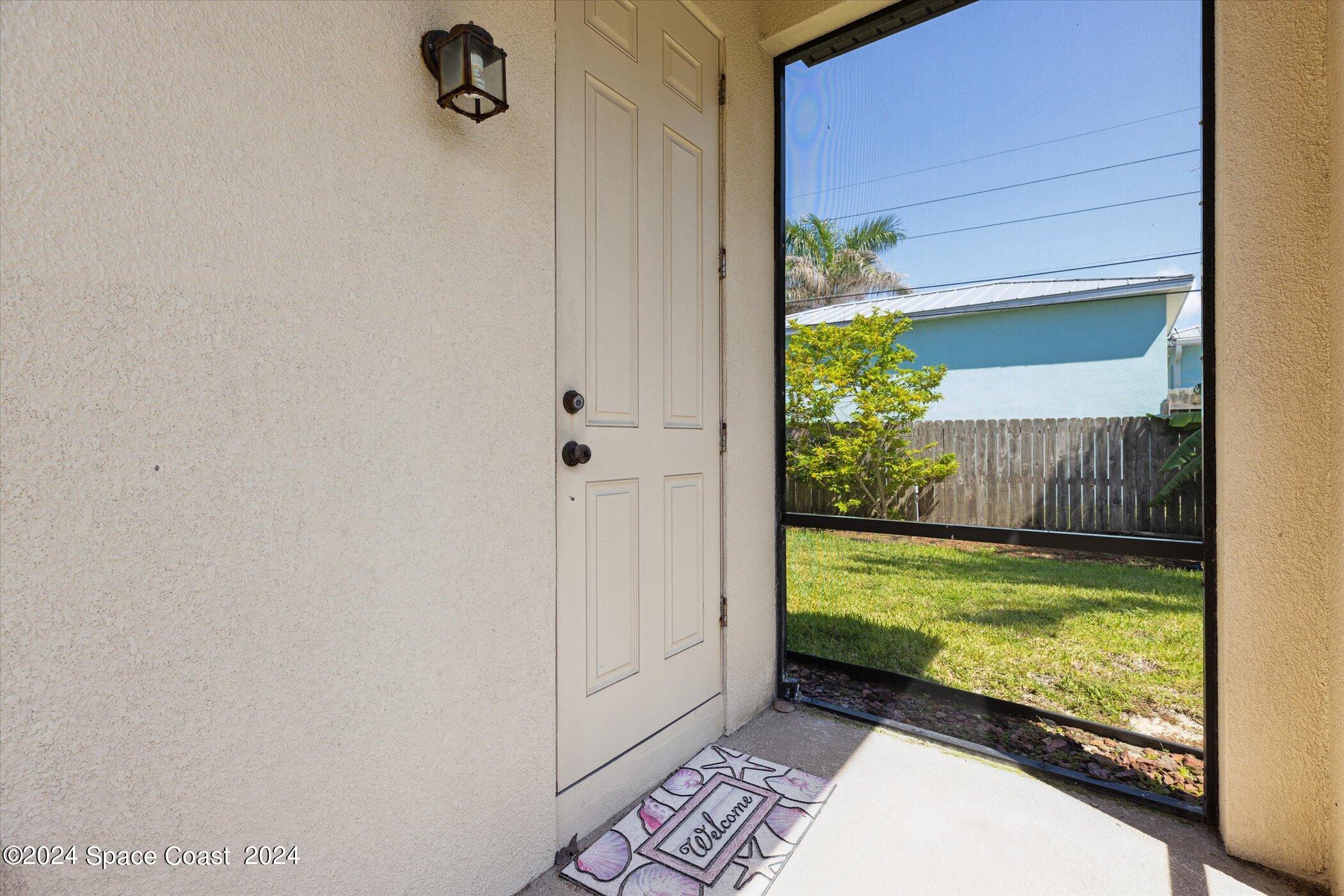 110 Poinsetta Street Indialantic, FL 32903 - Photo 59 of 67 a view of a porch with a bench