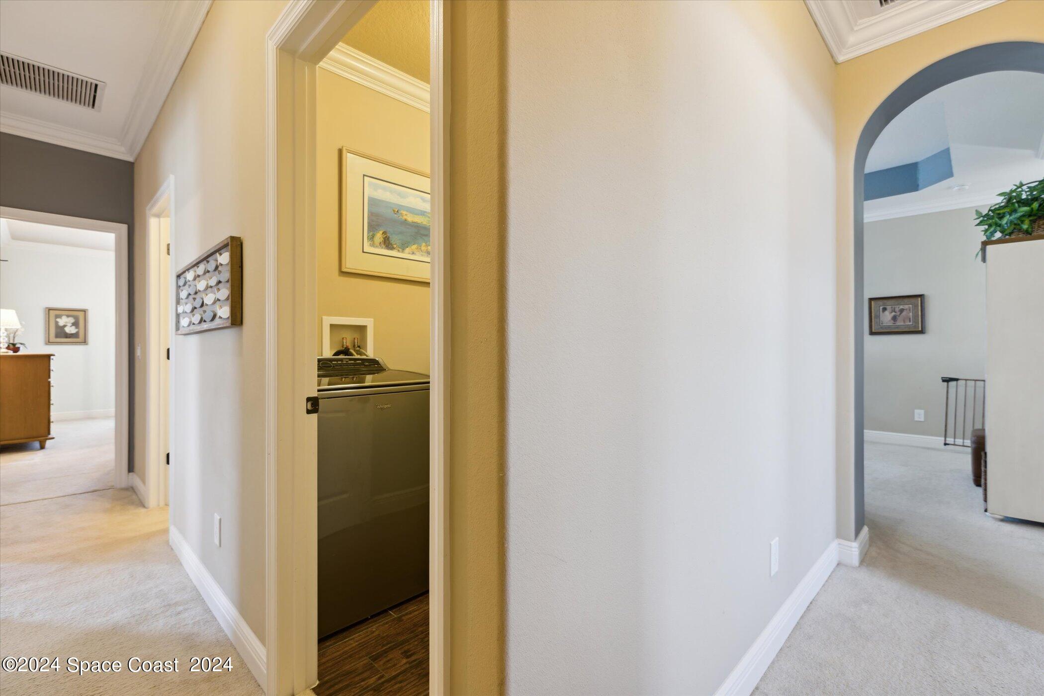 110 Poinsetta Street Indialantic, FL 32903 - Photo 9 of 67 a view of a hallway with wooden floor and living room