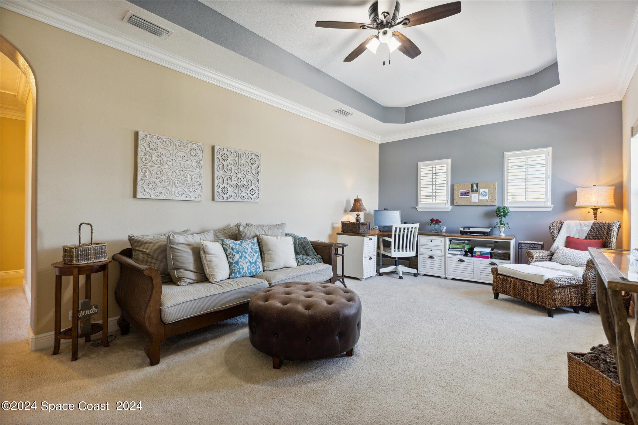 110 Poinsetta Street Indialantic, FL 32903 - Photo 10 of 67 a living room with furniture and a chandelier