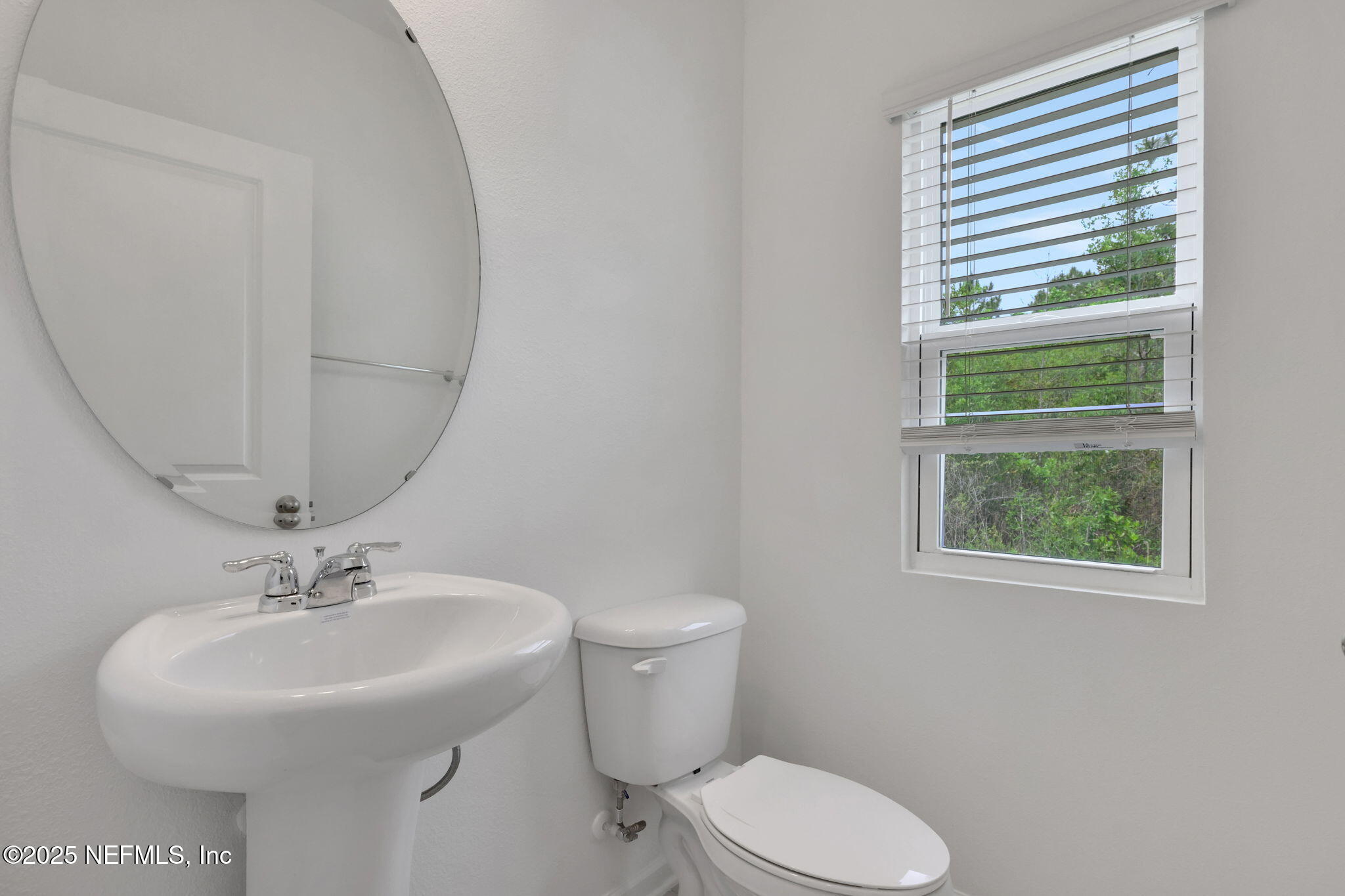 3829 Athenian Way Middleburg, FL 32068 - Photo 22 of 48 a bathroom with a sink toilet and a mirror