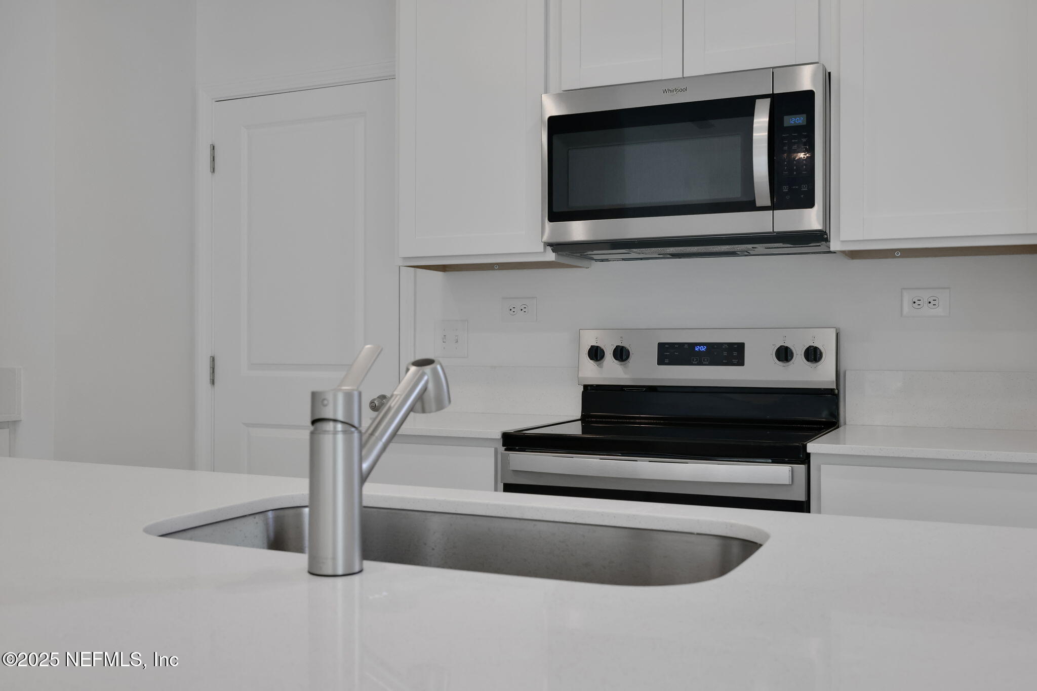 3829 Athenian Way Middleburg, FL 32068 - Photo 5 of 48 a view of living room with microwave and stove