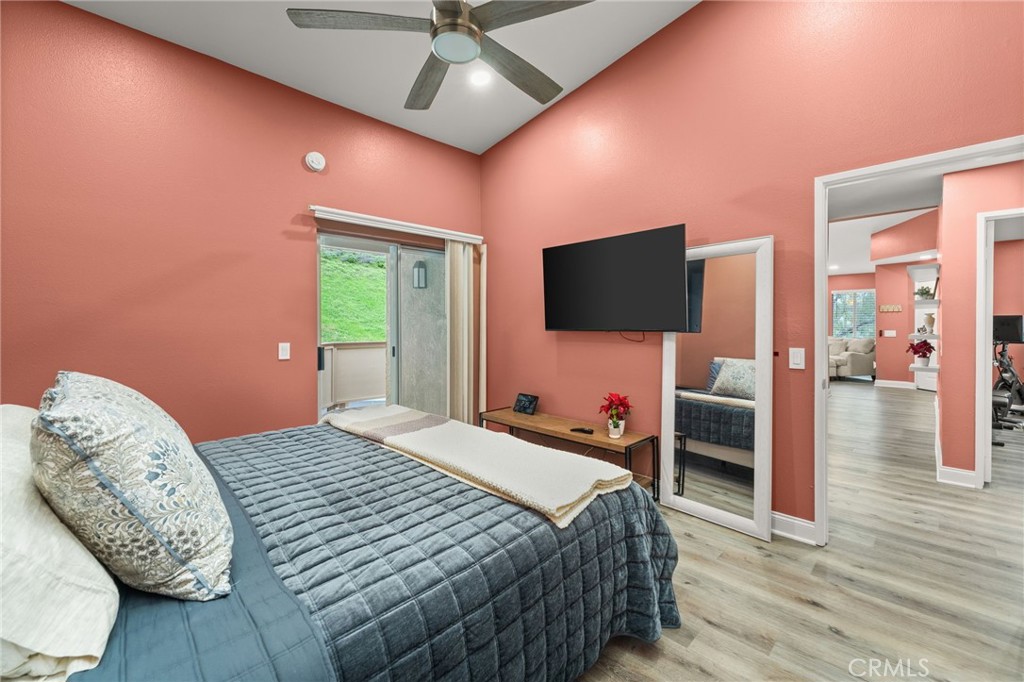 5470 Copper Canyon Road, Unit 2E Yorba Linda, CA 92887 - Photo 11 of 25 a bedroom with a bed and a flat screen tv