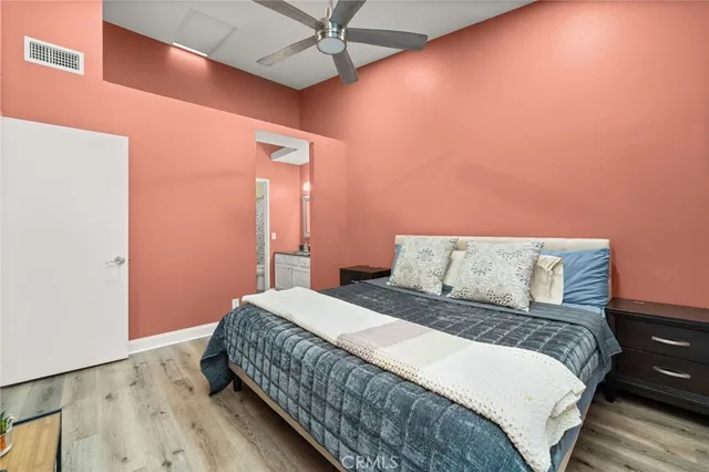 a bedroom with a bed and a dresser