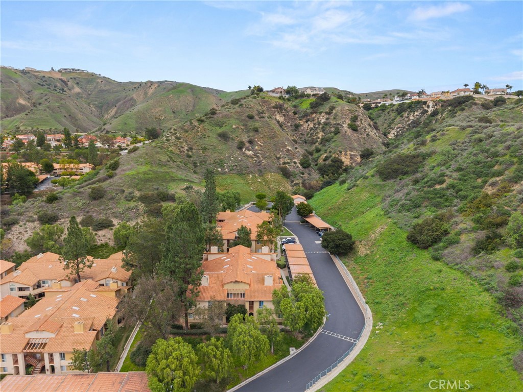 5470 Copper Canyon Road, Unit 2E Yorba Linda, CA 92887 - Photo 19 of 25 an aerial view of a house with mountain view