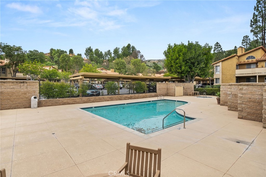 5470 Copper Canyon Road, Unit 2E Yorba Linda, CA 92887 - Photo 22 of 25 a view of a swimming pool with a patio