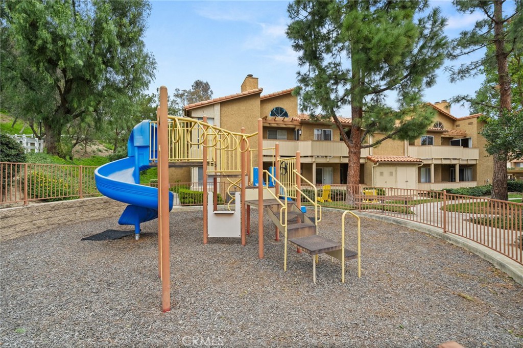 5470 Copper Canyon Road, Unit 2E Yorba Linda, CA 92887 - Photo 23 of 25 a view of a house with a yard chairs and a table