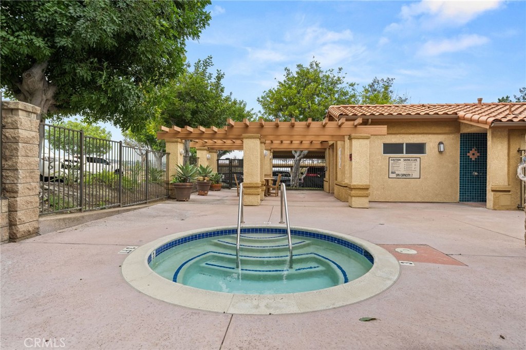 5470 Copper Canyon Road, Unit 2E Yorba Linda, CA 92887 - Photo 25 of 25 a swimming pool with outdoor seating and yard