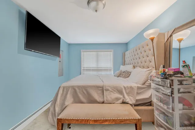 a bedroom with a bed and window