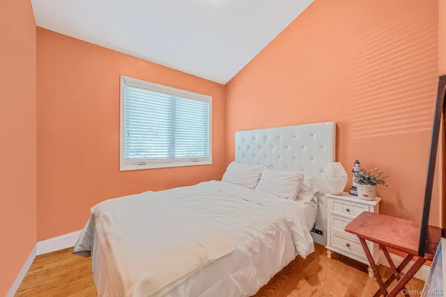 a bedroom with a bed and chair