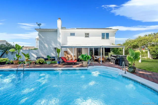 a view of a house with sitting area and furniture