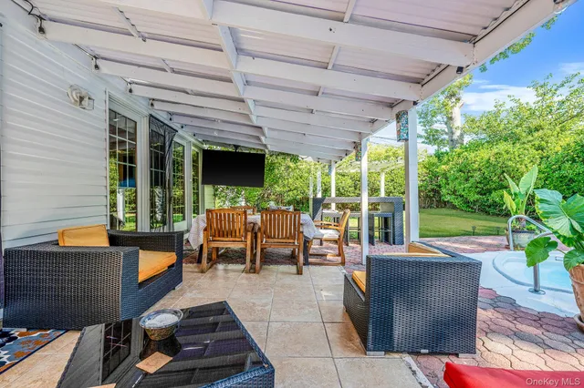 a outdoor space with patio lots of furniture and garden view