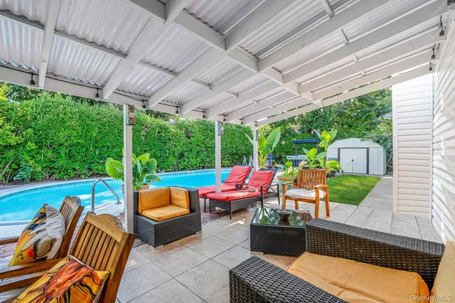 a outdoor sitting area with furniture and garden view