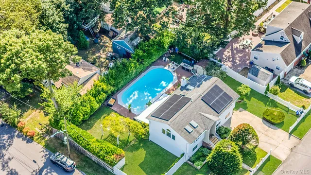 an aerial view of a house with a yard